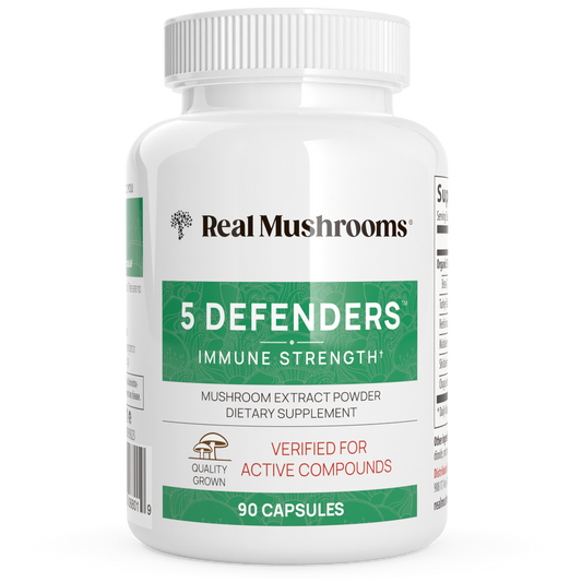 A white bottle labeled "Real Mushrooms 5 Defenders Organic Mushroom Blend Capsules," containing 90 vegan capsules rich in beta-glucans for immune support.