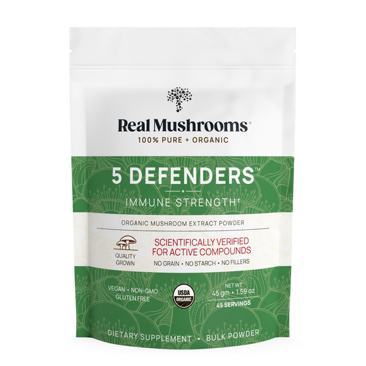 A white and green pouch of Real Mushrooms 5 Defenders Organic Mushroom Complex – Bulk Powder, a vegan, gluten-free, non-GMO, USDA organic mushroom extract featuring immune-supporting beta-glucans.