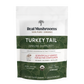 A white and green pouch labeled "Turkey Tail Extract - Bulk Powder" by Real Mushrooms, an organic, vegan, non-GMO, gluten-free supplement providing 45 servings of Turkey Tail powder to support immune health.