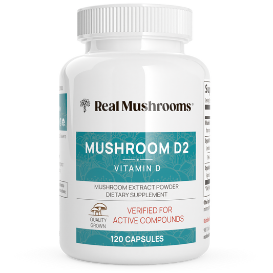 A white bottle labeled "Vitamin D from Organic Mushrooms" by Real Mushrooms, containing 120 vegan capsules of mushroom extract powder dietary supplement made from organic mushrooms.