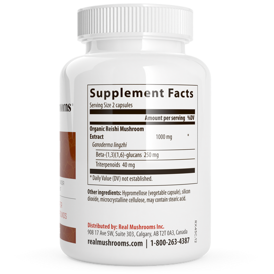 A white bottle of Real Mushrooms Organic Reishi Mushroom Capsules displays the Supplement Facts label with serving size, ingredients, and manufacturer details.