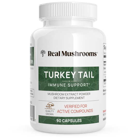 A white bottle labeled "Real Mushrooms Turkey Tail Mushroom Capsules" contains 90 capsules made from organic Turkey Tail mushrooms, formulated as a dietary supplement to support immune health.