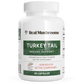 A white bottle labeled "Real Mushrooms Turkey Tail Mushroom Capsules" contains 90 capsules made from organic Turkey Tail mushrooms, formulated as a dietary supplement to support immune health.