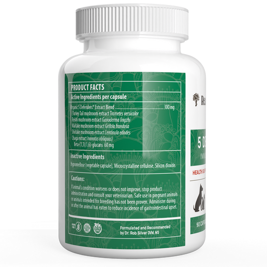 The 5 Defenders Organic Mushroom Blend Capsules for Pets from Real Mushrooms come in a white bottle with a green label, providing information on product facts, ingredients, and cautions. It contains 90 capsules enriched with organic mushroom extracts to offer additional benefits.