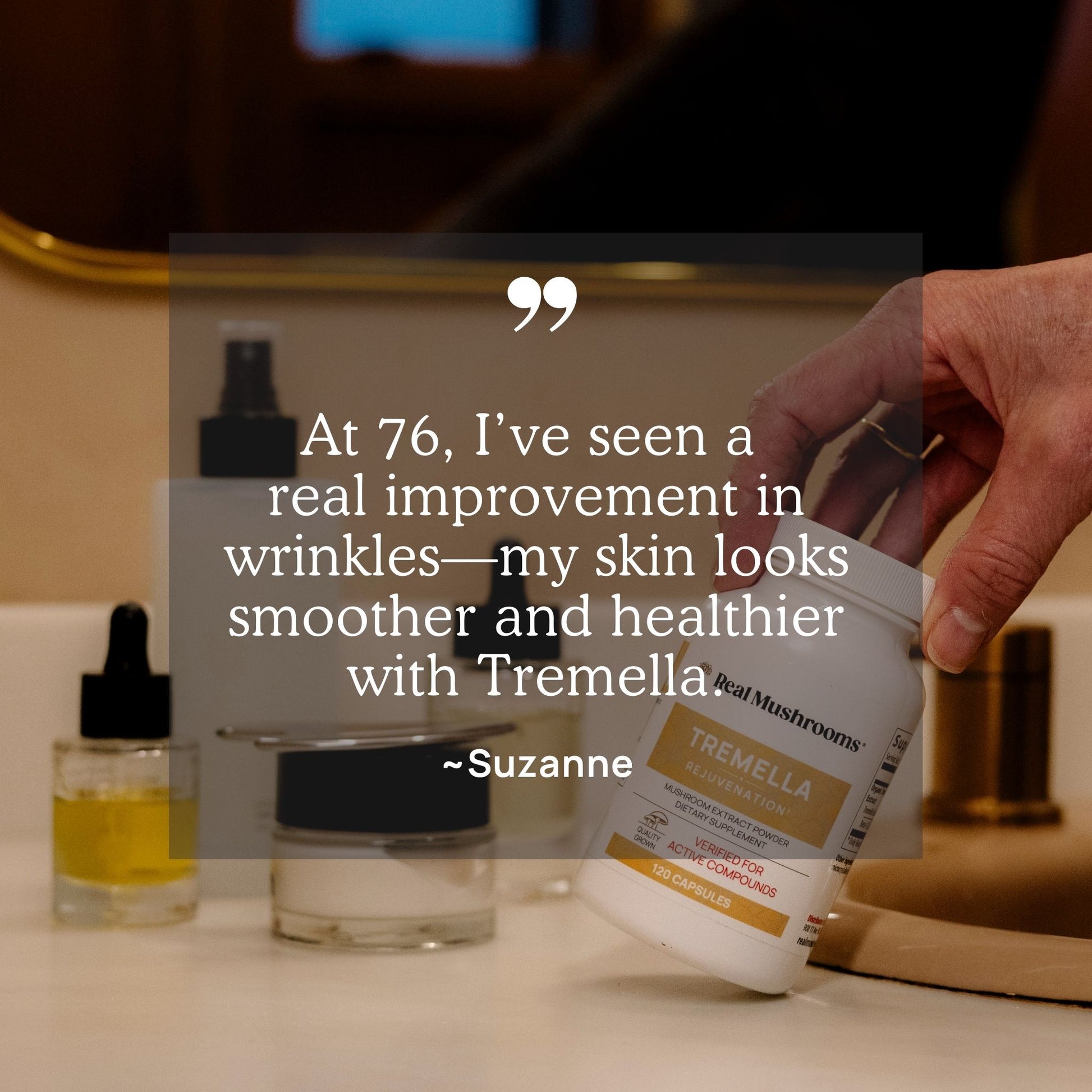 A hand holds a bottle of Organic Tremella Extract Capsules from Real Mushrooms beside skincare products on a bathroom counter, with a testimonial highlighting the certified organic mushrooms' benefits for reducing wrinkles and enhancing skin health at age 76.