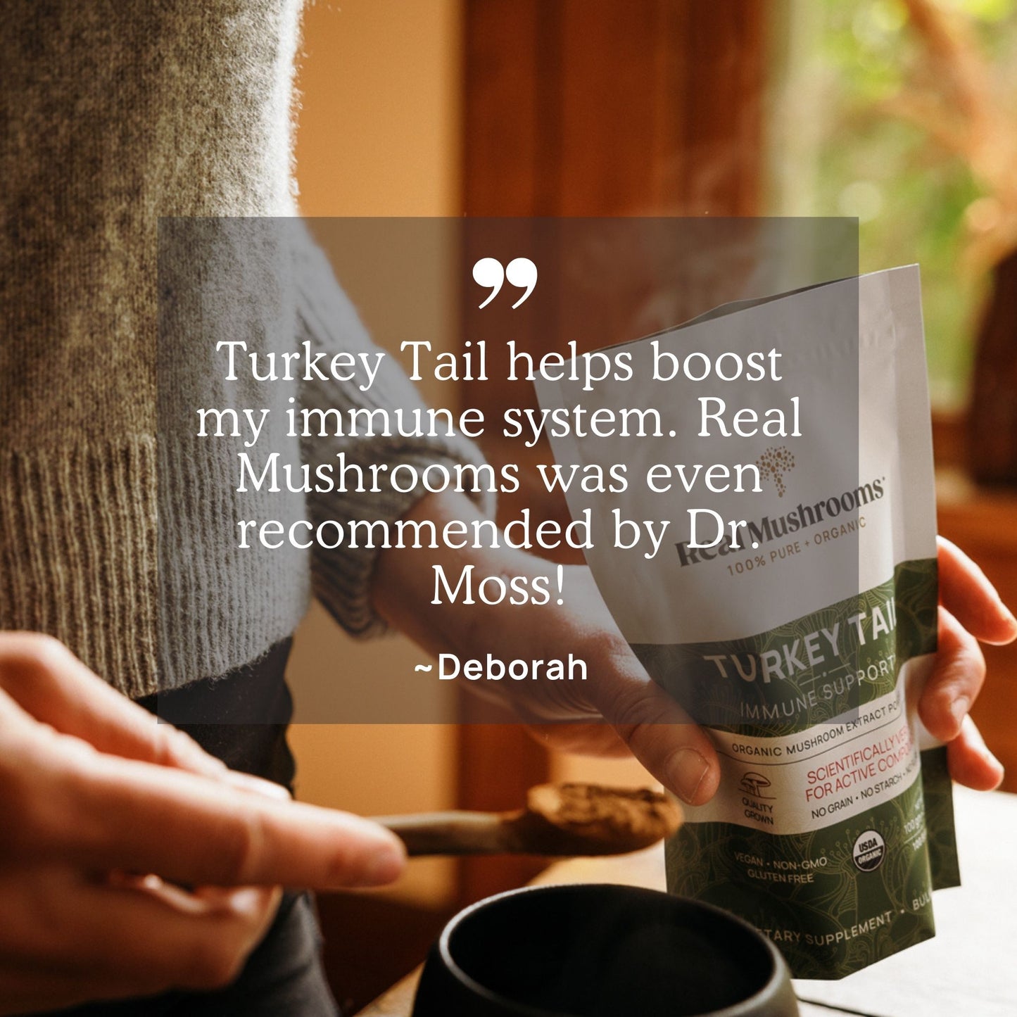 An individual holds a pouch of Real Mushrooms' Turkey Tail Extract - Bulk Powder along with a spoon, sharing a testimonial about its immune-boosting benefits due to the powerful beta-glucans.