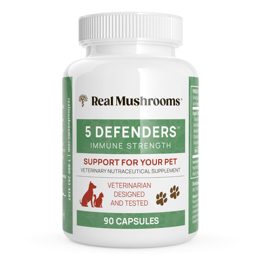 A white bottle labeled "Real Mushrooms 5 Defenders® Organic Mushroom Blend Capsules for Pets" contains 90 capsules with mushroom extracts and beta-glucans for pet immune support, featuring red text and dog and cat graphics.