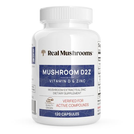 A white bottle of Real Mushrooms Mushroom D2Z dietary supplement contains 120 capsules with functional mushrooms for immune support.