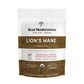 A white and gold pouch labeled “Real Mushrooms Lion’s Mane Mushroom Powder” contains 60g of organic, vegan, non-GMO, gluten-free powder—USDA organic and designed as a bulk dietary supplement for immune support.