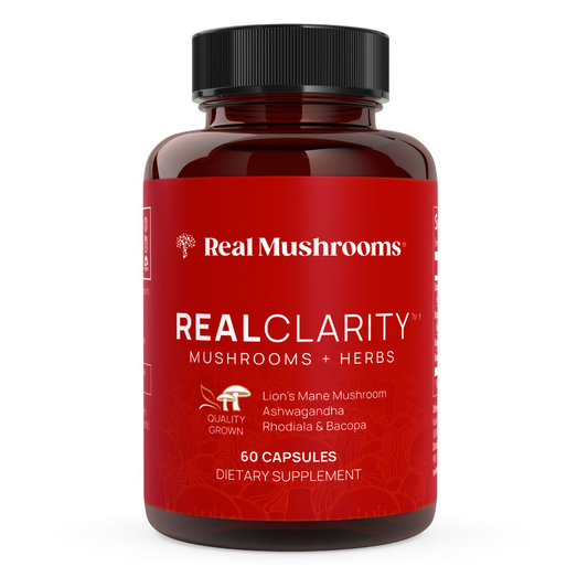 A red bottle of Real Mushrooms RealClarity contains 60 capsules with Lion's Mane, ashwagandha, rhodiola, and bacopa—an organic mushroom supplement designed to support mental clarity.