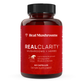 A red bottle of Real Mushrooms RealClarity contains 60 capsules with Lion's Mane, ashwagandha, rhodiola, and bacopa—an organic mushroom supplement designed to support mental clarity.