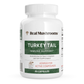 A white bottle labeled “Real Mushrooms Turkey Tail Mushroom Capsules,” containing 90 capsules made with mushroom extract powder rich in beta-glucans, designed to help support a healthy immune system.