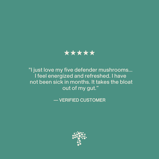 A customer review on a green background gives five stars to Real Mushrooms 5 Defenders® Organic Mushroom Complex – Bulk Powder for boosting energy, reducing bloating, and preventing illness; a tree logo appears at the bottom.