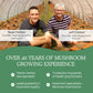 Two men smiling inside a Real Mushrooms mushroom growing facility, representing over 40 years of experience in the mushroom industry and expertise in organic extracts and mushroom quality.