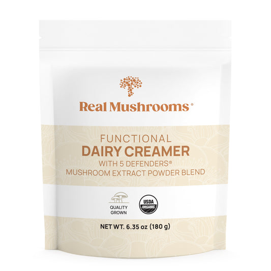 A package of Real Mushrooms Functional Dairy Creamer Powder with organic mushroom extract, labeled "USDA Certified Organic" and noting a net weight of 6.35 oz.